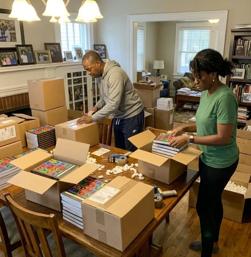Family packing orders at the kitchen table